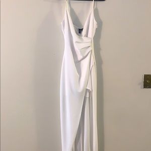 A white strap dress with a split on it's side